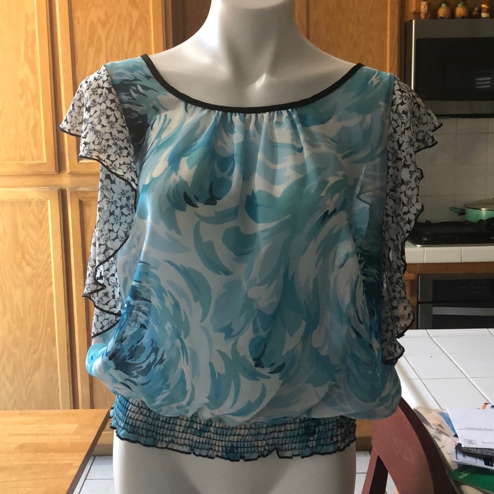 Sheer blue and white, black flower top